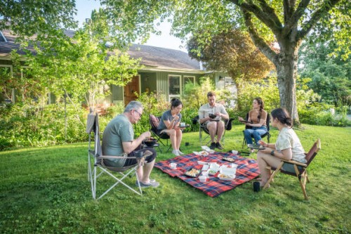 multi-generation family reunion, multiracial japanese picnic at home garden - junk food stock pictures, royalty-free photos & images