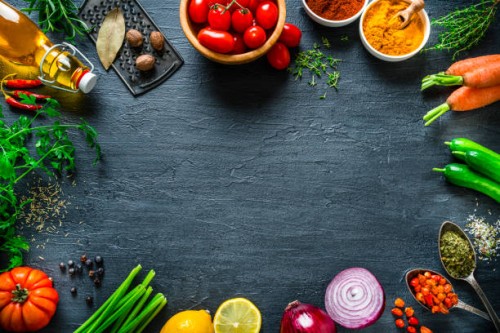 multi colored vegetables and spices frame on black slate background. overhead view - food stock pictures, royalty-free photos & images