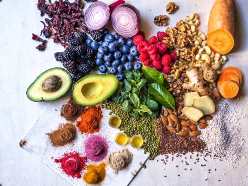 multi colored vegetables, fruits, legumes, nuts and spices on wooden table - food stock pictures, royalty-free photos & images