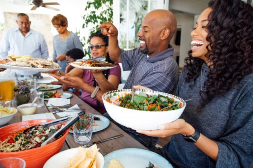 multigenerational family enjoy meal together on patio - food stock pictures, royalty-free photos & images