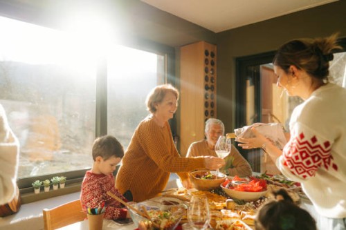 multigenerational family having a meal together on christmas - food stock pictures, royalty-free photos & images
