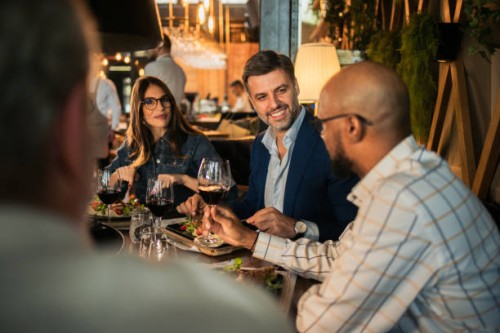 multiracial business team enjoying at the restaurant - food stock pictures, royalty-free photos & images