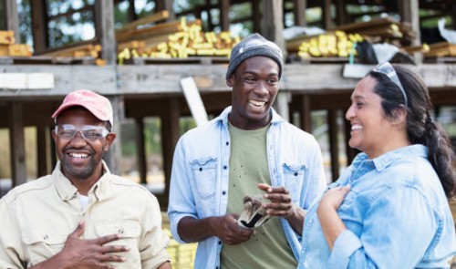 multiracial group of workers at lumberyard, laughing - home decoration stockfoto's en -beelden