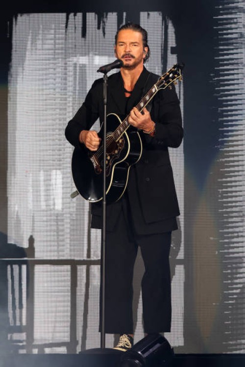 Musician Ricardo Arjona performs during the Blanco y Negro tour at FTX Arena on June 4, 2022 in Miami, Florida.