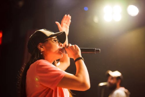 musician singing with microphone on stage - concert stock pictures, royalty-free photos & images