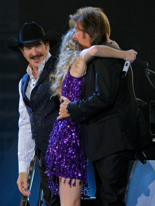 Musicians Kix Brooks , Ronnie Dunn of the band Brooks & Dunn with Taylor Swift onstage during Brooks & Dunn's The Last Rodeo Show at MGM Grand Garden...