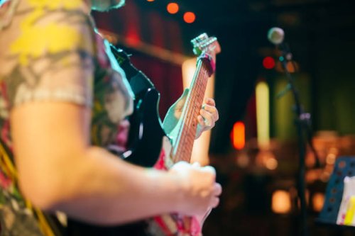 musicians playing guitar on stage - concert stock pictures, royalty-free photos & images