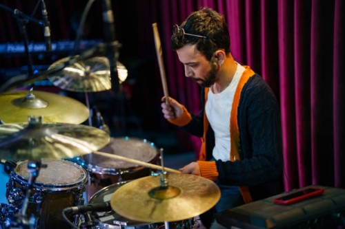 musicians plays drums on stage - concert stock pictures, royalty-free photos & images