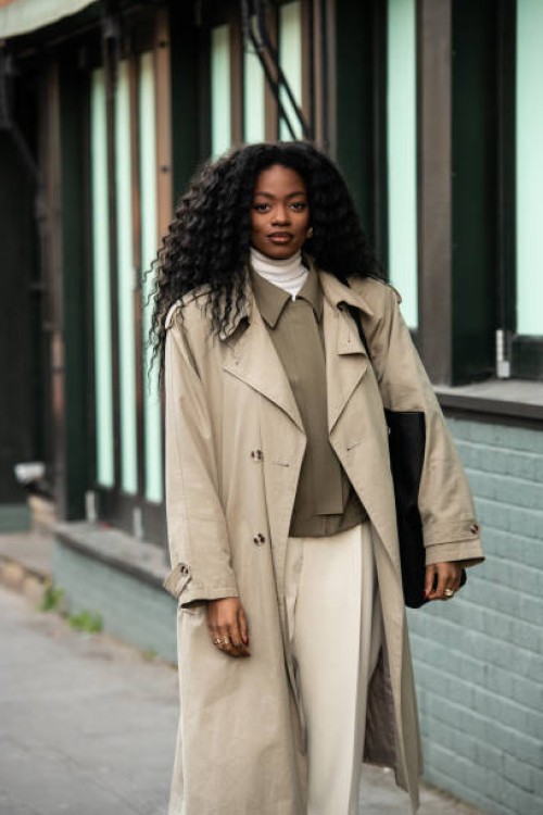 Nadine Petzke wears a Primark coat, Zara jacket, roll neck jumper and trousers outside the Christopher Kane show during London Fashion Week February...