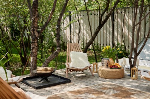 neat and tidy terrace with easy chairs firewood placed on daylight - garden decoration stock pictures, royalty-free photos & images