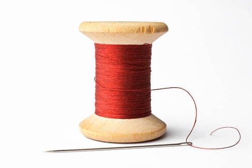 needle and red line - fashion stock pictures, royalty-free photos & images