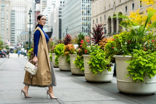 nicely dressed businesswoman seen exiting the building in manhattan after work - fashion stock pictures, royalty-free photos & images