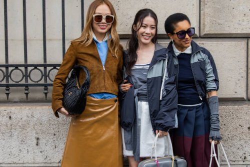 Niki Wu Jie wears brown suede jacket, vinyl skirt, black bag & Jenny Tsang wears grey jacket, wrapped jumper & Tamu McPherson wears jackets,...