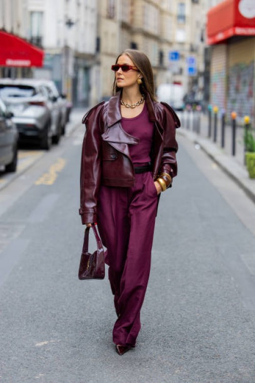 Nina Sandbech wears burgundy jacket SourceUnknown, wide leg pants Dorothee Schumacher, bag and shoes YSL, sunglasses Gucci during Womenswear...