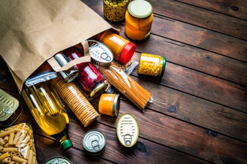non-perishable foods coming out a paper bag. copy space - food stock pictures, royalty-free photos & images