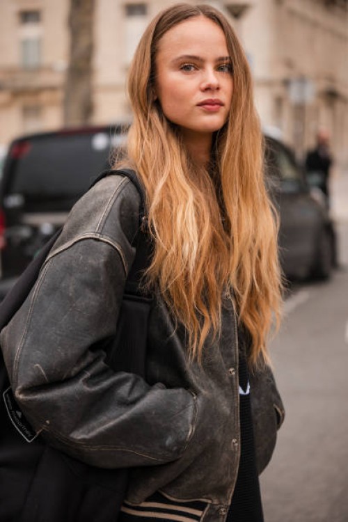 Olivia Vinten wears brown leather jacket, outside Chanel, during the Womenswear Fall/Winter 2024/2025 as part of Paris Fashion Week on March 05, 2024...