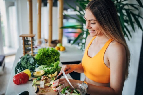 one fit woman making healthy vegetable salad for breakfast - food stock pictures, royalty-free photos & images