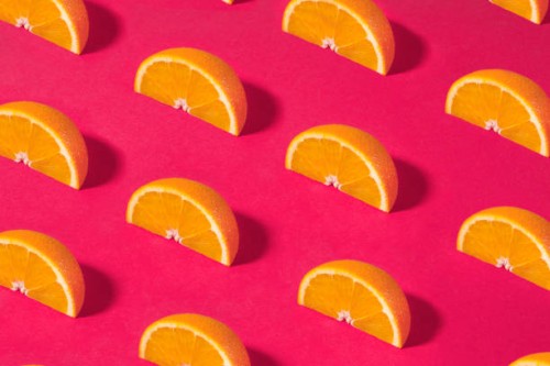 orange fruit pattern on pink background - food stock pictures, royalty-free photos & images