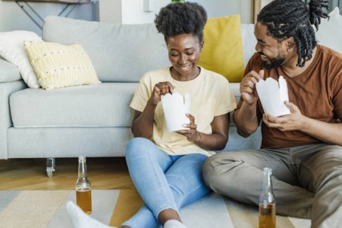 ordering and eating fast food meal at home - junk food stock pictures, royalty-free photos & images