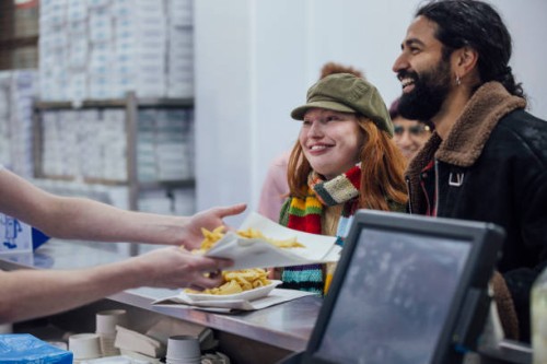 ordering fish and chips - junk food stock pictures, royalty-free photos & images