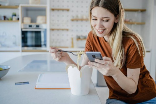 ordering food delivery and e-commerce - junk food stock pictures, royalty-free photos & images