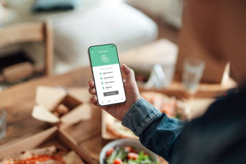 ordering food delivery on smart phone - food stock pictures, royalty-free photos & images