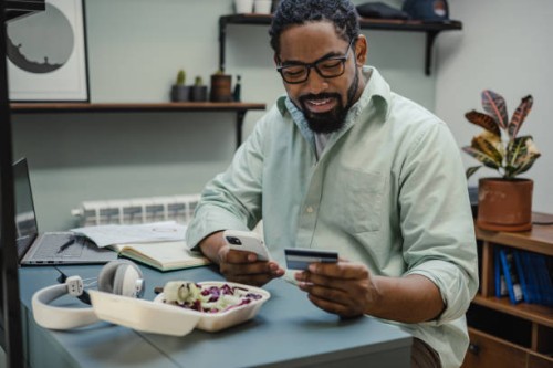 ordering food online while working from home - junk food stock pictures, royalty-free photos & images