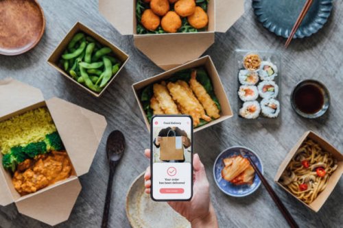 ordering takeaway meal at home - junk food stock pictures, royalty-free photos & images