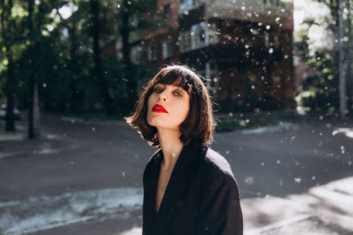 outdoor portrait of young brunette in black jacket - fashion stock pictures, royalty-free photos & images
