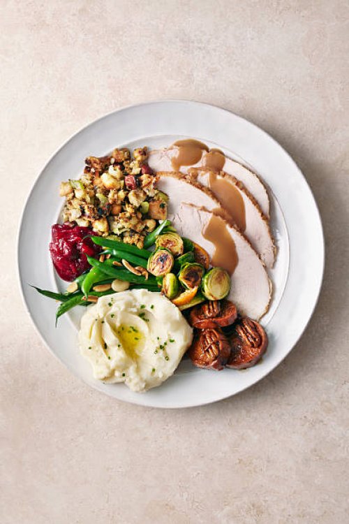 overhead of turkey meal on plate - food stock pictures, royalty-free photos & images