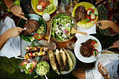 overhead view of friends dining at table outdoors - food stock pictures, royalty-free photos & images