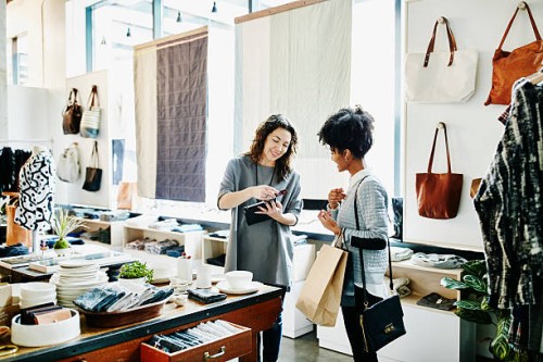 owner processing credit card with digital tablet - fashion stock pictures, royalty-free photos & images