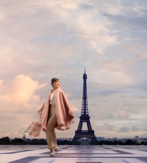 pacific islander woman walking near eiffel tower, paris, ile - fashion stock pictures, royalty-free photos & images