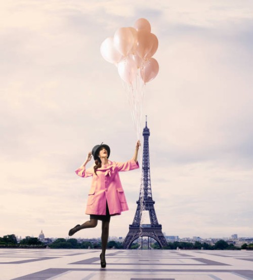 pacific islander woman with balloons near eiffel tower, paris, ile - fashion stock pictures, royalty-free photos & images