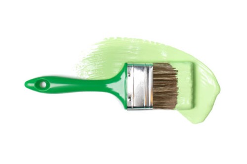 paintbrush and smooth smear of green pigment isolated on white background. concept of home repair. flat lay style and close-up - home decoration stock pictures, royalty-free photos & images