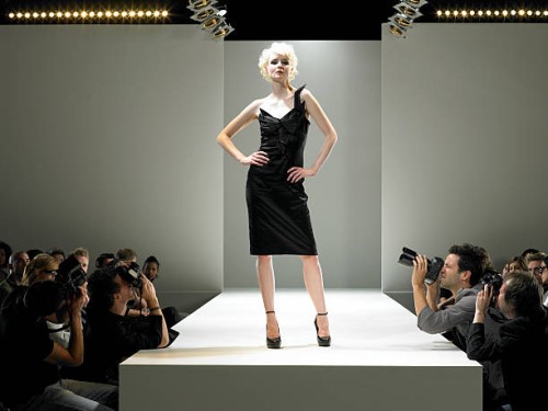 paparazzi photographing fashion model on catwalk - fashion stock pictures, royalty-free photos & images