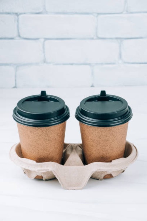 paper cup with coffee. close-up of a disposable cup. - junk food stock pictures, royalty-free photos & images