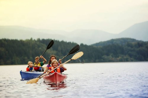 parents and sons (10-12) canoeing on lake, staffel lake, murnau, bavaria, germany - travel stock pictures, royalty-free photos & images