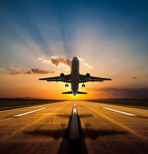 passenger airplane taking off at sunset - travel stock pictures, royalty-free photos & images