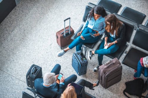 passengers sitting on seats in departure area - travel stock pictures, royalty-free photos & images