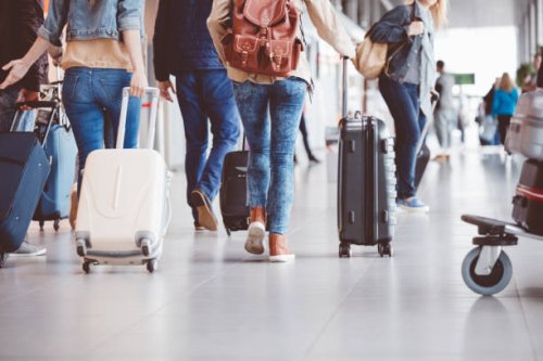 passengers walking in the airport terminal - travel stock pictures, royalty-free photos & images