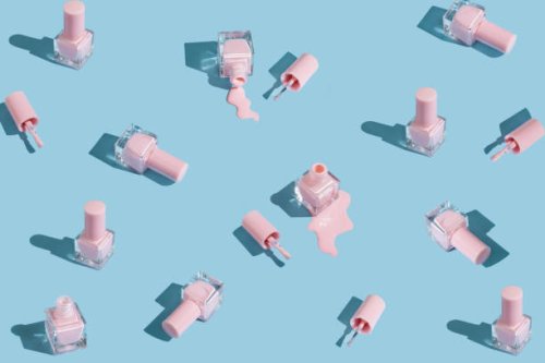 pattern made of spilled bottles of pink nail polish on pastel blue background. manicure and pedicure concept. flat lay, top view - nails art stock pictures, royalty-free photos & images