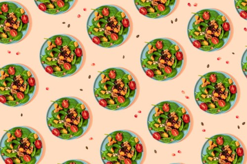 pattern of plates of fresh ready-to-eat vegan salad - food stock illustrations