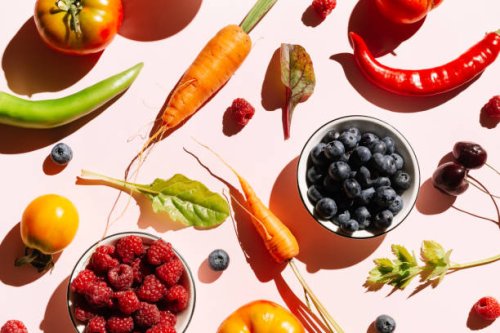 pattern of variety fresh of organic berry fruits and vegetables and healthy vegan meal ingredients on pink background. healthy food, clean eating, diet and detox, eco friendly, no plastic concept. flat lay, top view - food st