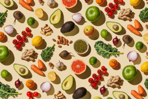 pattern of variety fresh of organic fruits and vegetables and healthy vegan meal ingredients on beige background. healthy food, clean eating, diet and detox, eco friendly, no plastic concept . flat lay, top view - food stock 
