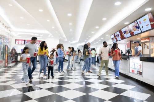 people at the cinema buying snacks at the concession stand - junk food stock pictures, royalty-free photos & images