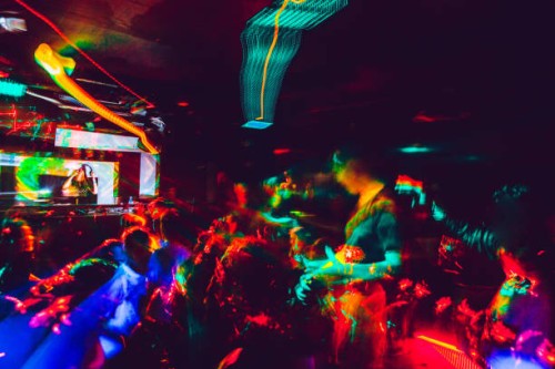 people dancing in nightclub - concert stock pictures, royalty-free photos & images