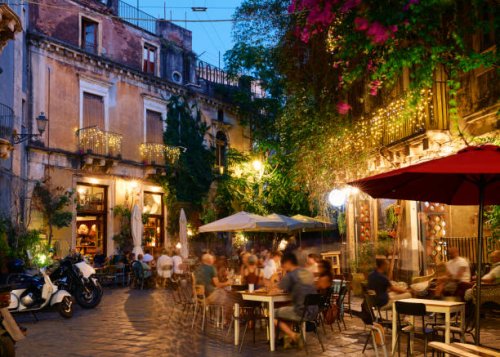 people dining outside restaurants and bars at dusk in catania - food stock pictures, royalty-free photos & images