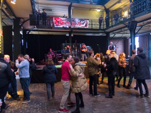 people drink and dance in the indoor fish market in hamburg. - concert stock pictures, royalty-free photos & images