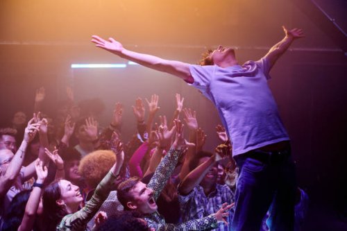 people enjoying an evening out at a music venue. - concert stock pictures, royalty-free photos & images